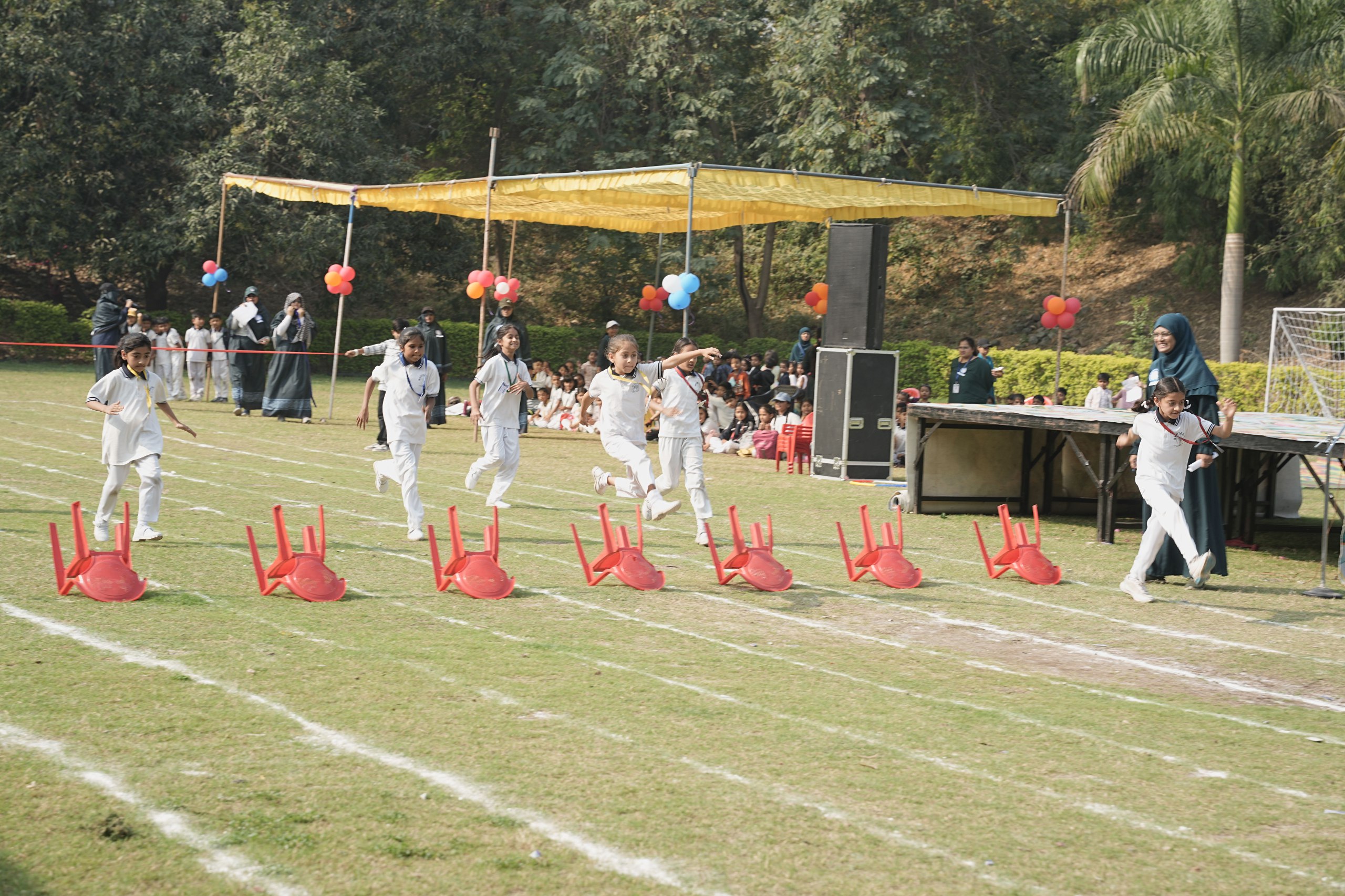 Students racing during Sports Day at Blossom School